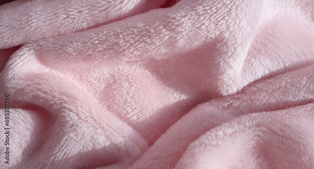 Fototapeta premium Light pink fleece fabric. Polyester. Pile fabric. Fabric texture. Fleece.