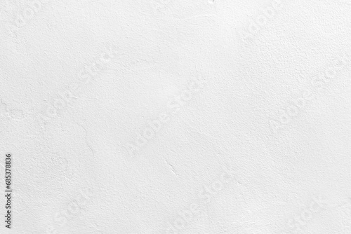 White concrete wall texture background. Uneven render stucco white painted concrete wall texture background. Rough and grunge wall in the sun.  photo
