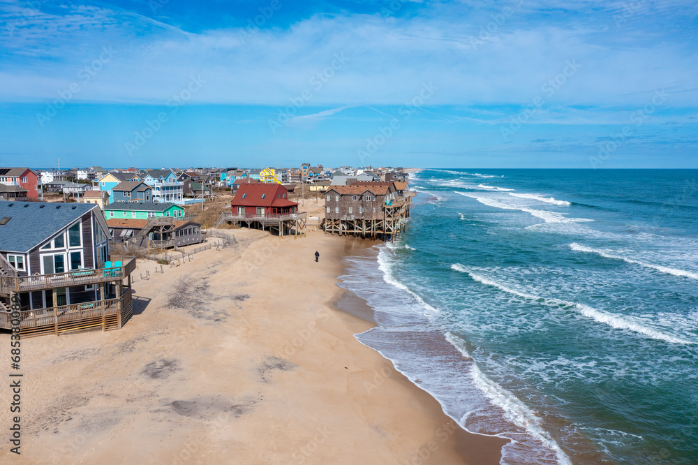 Aerial View of Houses on the Beach With the Ocean Coming up to the Pilings in Rodanthe North Carolina