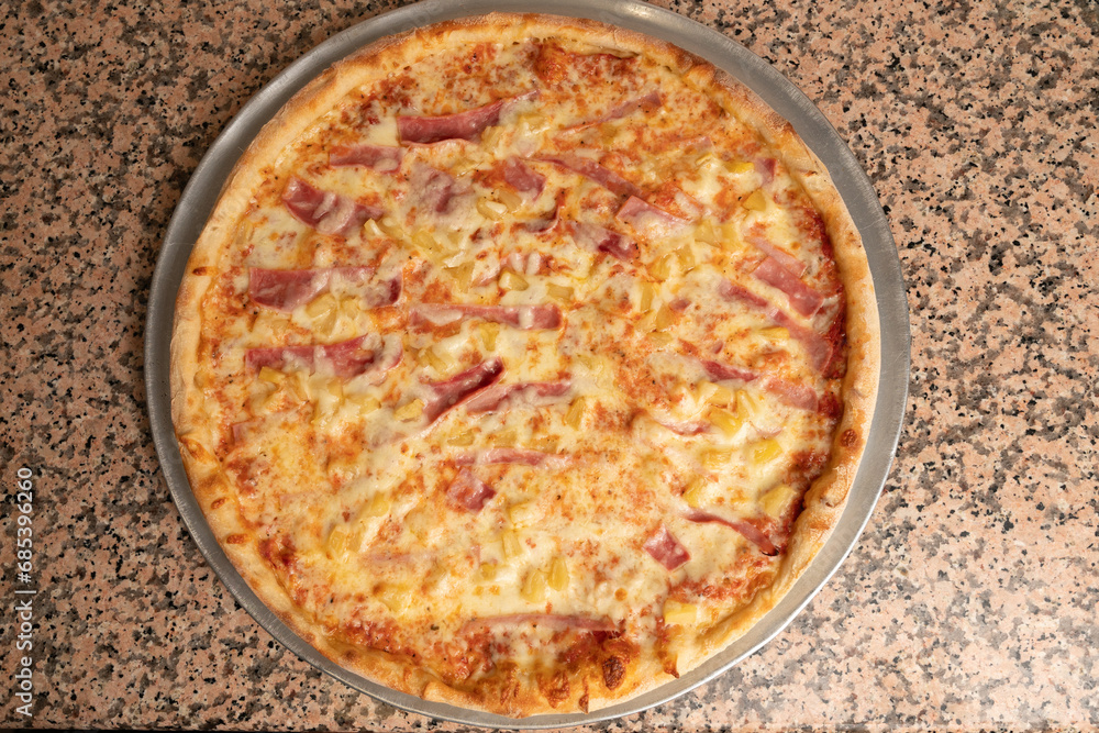 Hawaiian pizza with ham and pineapple