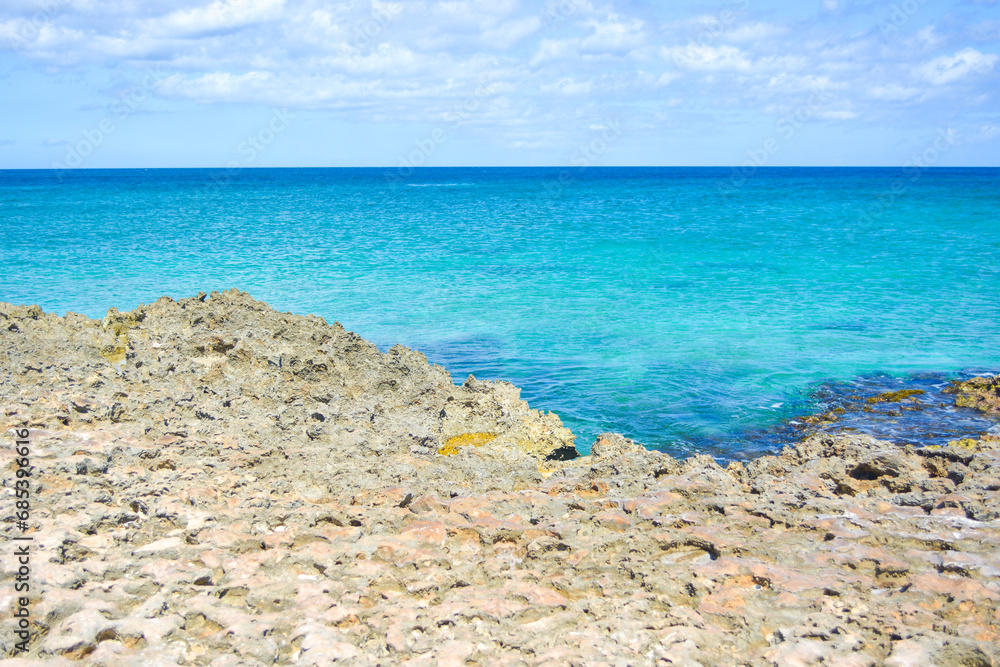 A view on the rocky sea pool. Beautiful Caribbean summer seascape scene. Space for text. 