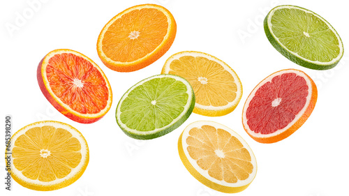 Mix of falling orange, grapefruit, lime and lemon slices isolated on white background photo