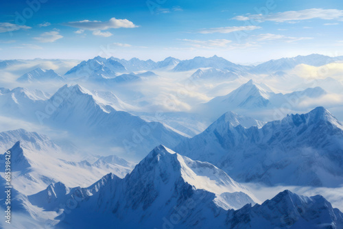 A snowy mountain range seen from a bird's eye view, showcasing the pristine beauty of snow-covered peaks and valleys. © Hunman