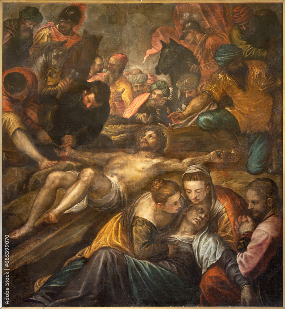 VICENZA, ITALY - NOVEMBER 5, 2023: The painting  Jesus is nailed the the cross in the Catheral by Alessandro Maganza (1587-1589).