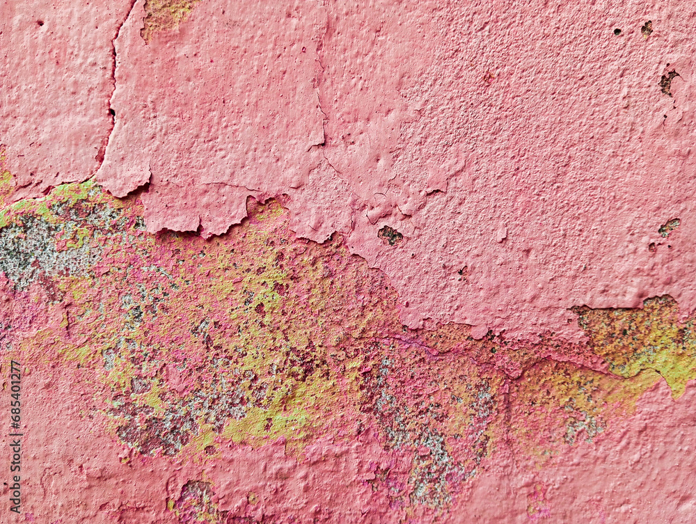 Weathered cement wall with peeling paint. Abstract colorful grunge background. Old damaged concrete cement wall with flaking paint.