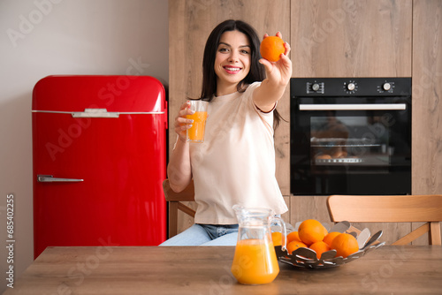 Beautiful woman with orange...