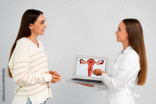 Female gynecologist showing...
