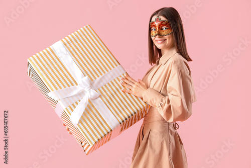 Smiling woman in masquerade...