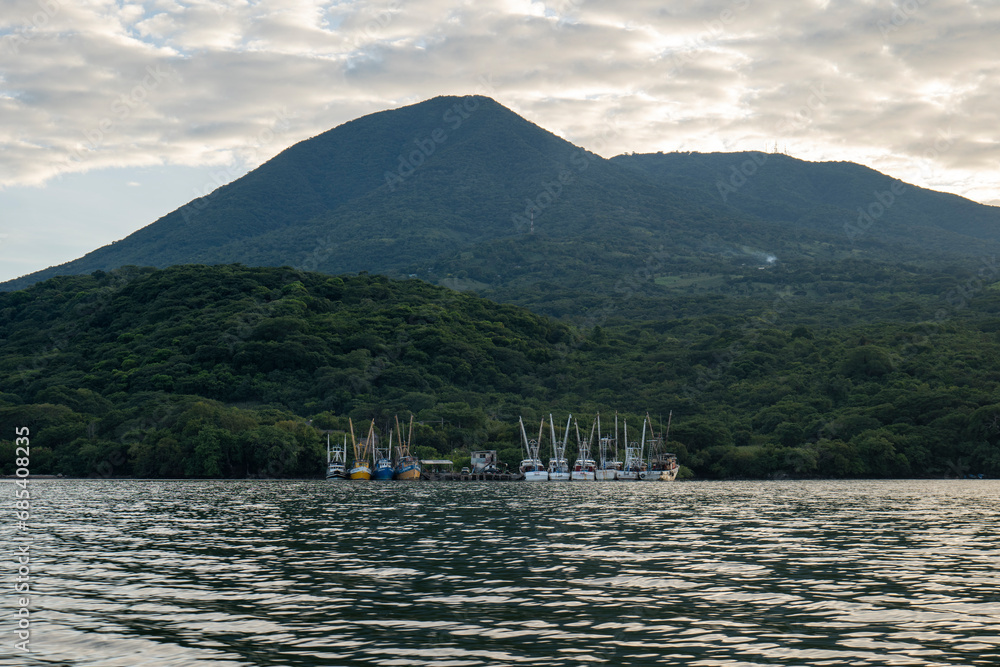 Quiet View of a Marina near La Union in Salvador with 10 Small Boats and Dramatic Sky at Sunset