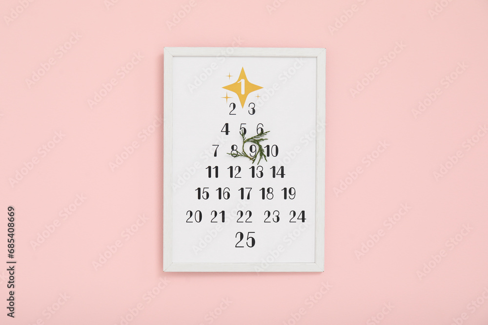 Christmas calendar on pink wall Christmas calendar on pink wall