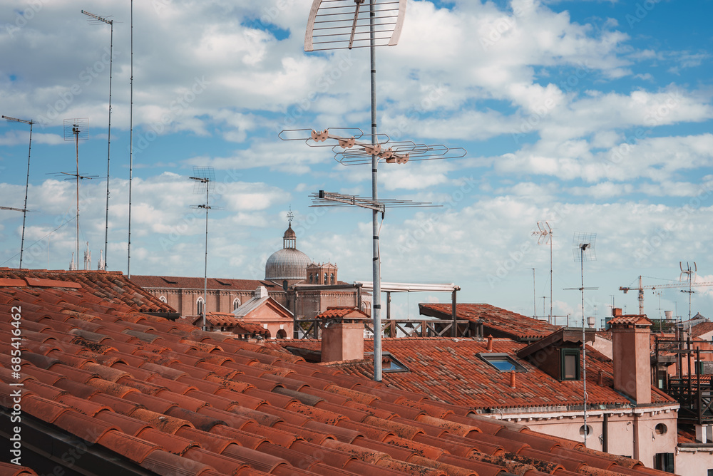 Experience the timeless beauty of Venice, Italy with this stunning view of the vibrant red rooftops. The tranquil and picturesque scene captures the unique charm of the city's architecture. Experience the timeless beauty of Venice, Italy with this stunning view of the vibrant red rooftops. The tranquil and picturesque scene captures the unique charm of the city's architecture.