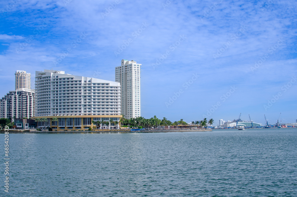 Photography of a Florida Bay with building in background.