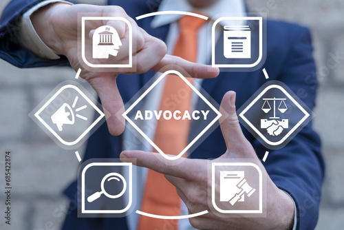 Man using virtual touch interface sees word: ADVOCACY. Business advocacy and lawyer consulting concept. Advocacy legal public service.