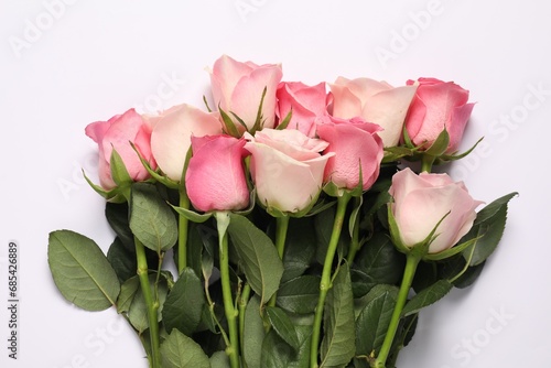 Beautiful roses on white background  top view