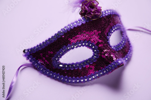 Carnival mask on lilac background