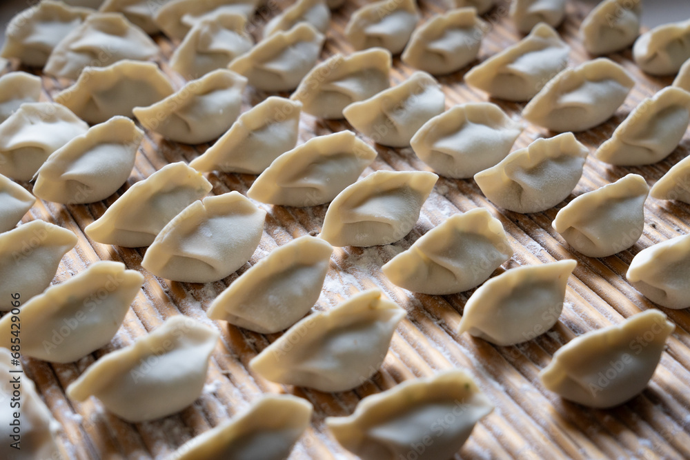 making dumplings in the kitchen. traditional food raw dimplings
making dumplings in the kitchen. traditional food raw dimplings