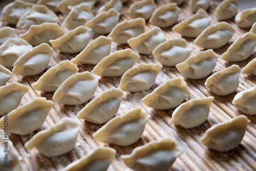 making dumplings in the kitchen. traditional food raw dimplings 