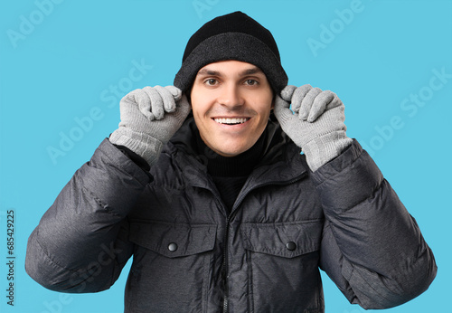 Smiling young man in winter...