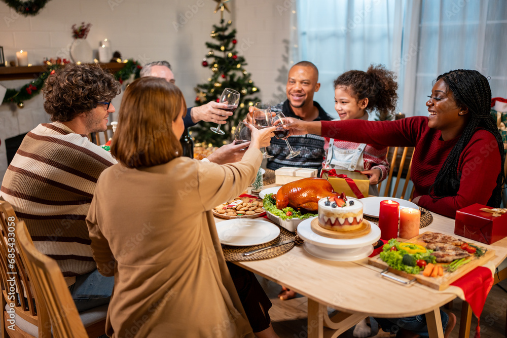 Multi-ethnic family celebrating Christmas party together in house. 