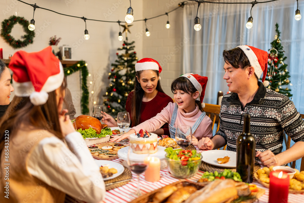 Asian lovely family celebrating Christmas party together in house. Asian lovely family celebrating Christmas party together in house.