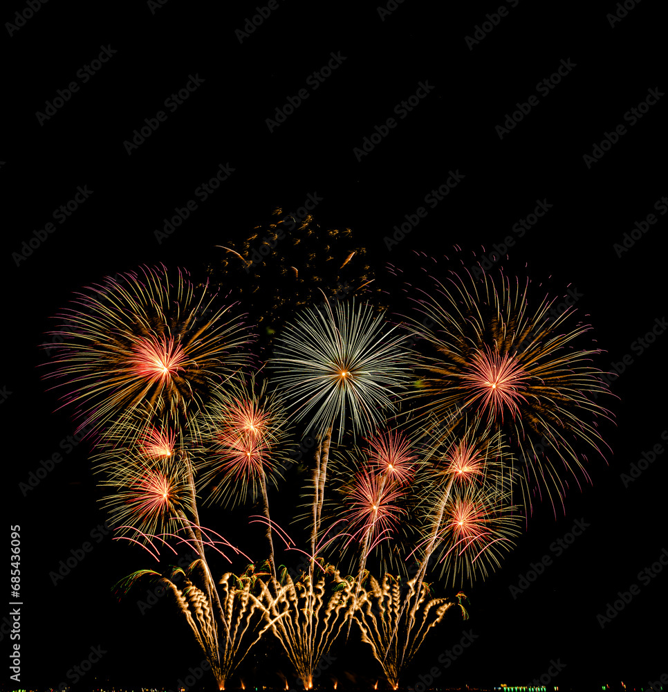 Fireworks show under defocus or blur concepts with isolated black background at night, this celebration is for the International Fireworks Festival in Pattaya on Nov 24-25 in Thailand.