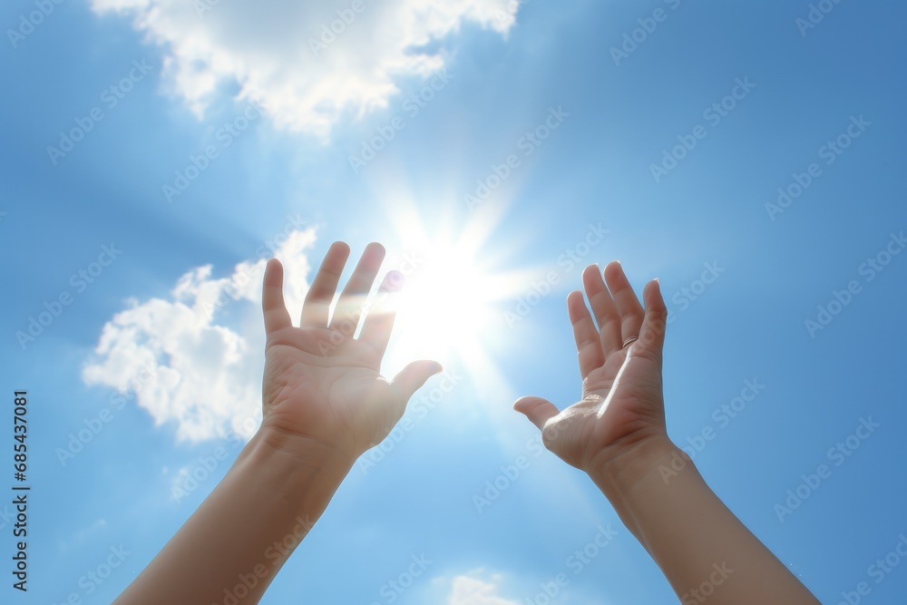 Hands to heaven, person with hand up looking at the sky Hands to heaven, person with hand up looking at the sky
