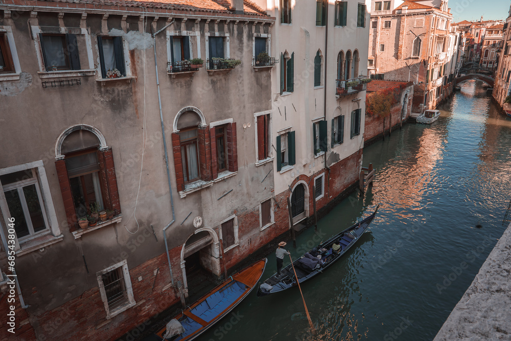 Explore the charm of Venice with this serene canal view. The image captures the essence of the city with a gondola gliding through the water, showcasing the timeless beauty of Venice. Explore the charm of Venice with this serene canal view. The image captures the essence of the city with a gondola gliding through the water, showcasing the timeless beauty of Venice.