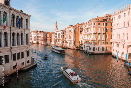 Breathtaking view of the Grand Canal in Venice, Italy, showcasing stunning architecture and scenery. Part of a collection highlighting the beauty of Venice during the summer. © Aerial Film Studio
