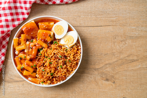 Korean instant noodles with Korean rice cake and fish cake and boiled egg photo