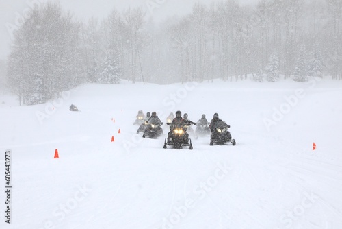 Trail with approaching snowmobiles © Douglas