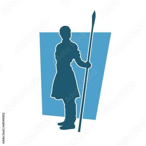 Silhouette of a female warrior carrying spear weapon. Silhouette of a female fighter in action pose.