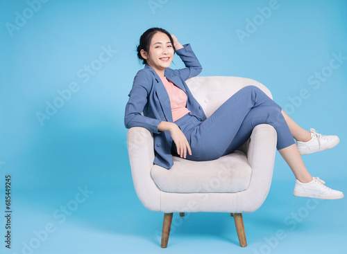 Photo of young Asian businesswoman on background