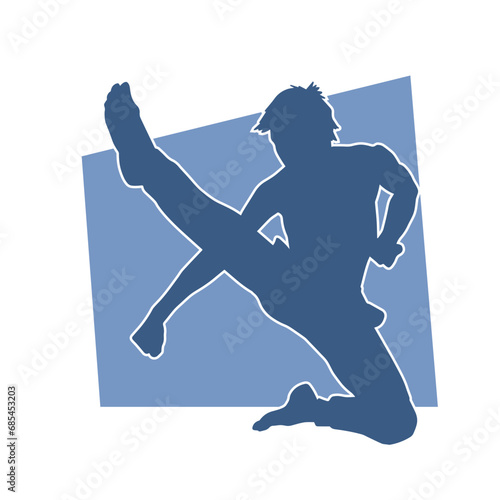 Silhouette of a male kickboxing athlete in action pose. Silhouette of a kickboxer man doing martial art pose.