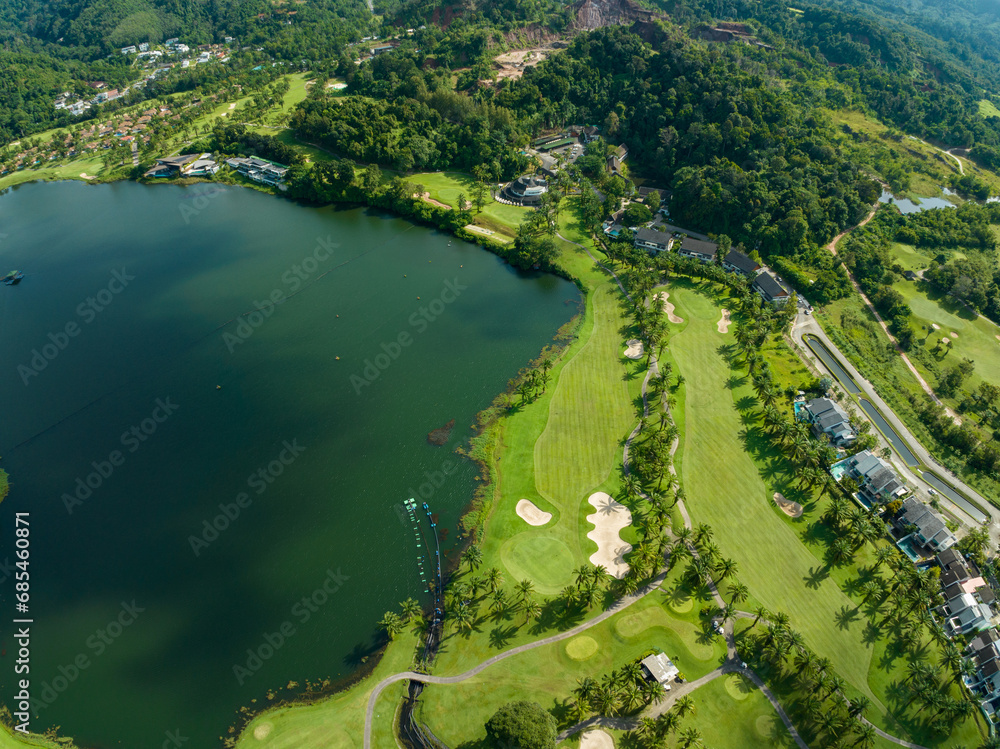 Aerial view of beautiful green golf field fairway and putting green,Top view image for sport background and travel nature background, Amazing green nature view