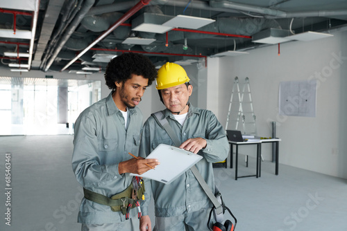 Engineers discussing problems they need to fix before facility commissioning