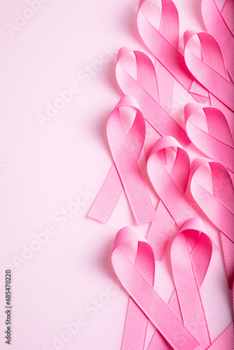 Pink colored ribbon isolated on pink background. Symbol of breast cancer awareness. healthcare and medicine concept. Preventive measures. Women health