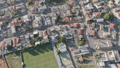Slow aerial flyover of a soccer field and neighborhoods in Brasilia, Brazil. photo