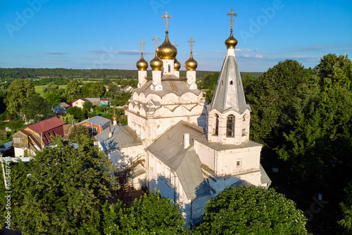 Pastoral landscape from above with a view of an old Russian Orthodox church in white. Spaso-Preobrazhensky Church of the 17th century. The village of Spas-Zagorie, Kaluga region, Russia