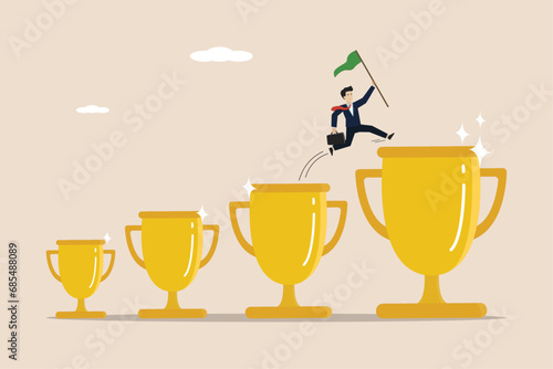 Winners, business people get awards, entrepreneurs get promotions or titles, smart entrepreneurs jump from the cup to the big trophy to get success.