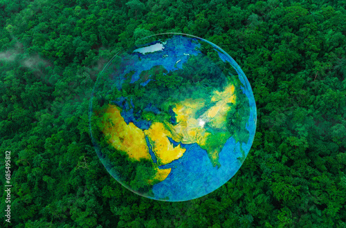 Atmospheric aerial view of the green forest with the earth Demonstrate the concept of preserving the top ecosystem and natural environment and Save Earth.	
