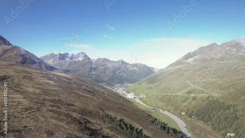 Aerial small town Kühtai, Austria within beautiful calming mountain alps summer sunny landscape photo