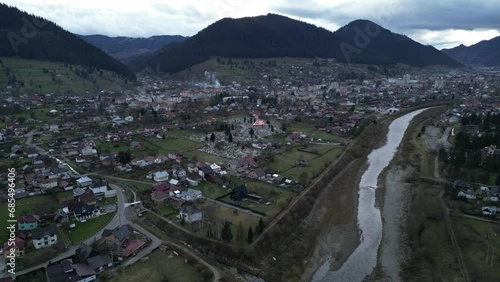 aerial falling back from the quaint mountain town of Campulung Moldovnesc in Romania photo