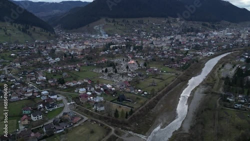 aerial tilting in toward the picturesque Romanian town of Compulung Moldovenesc photo