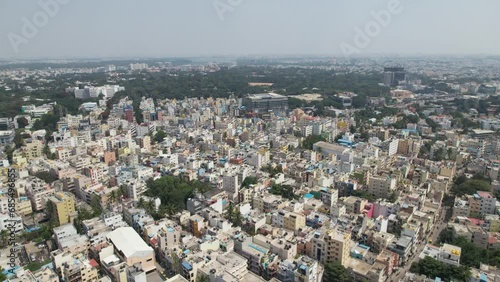 Dramatic aerial footage shows Bengaluru, the capital of Karnataka, as a bustling residential neighbourhood surrounded by single-family homes and apartment buildings. Video taken from a DJI drone. photo