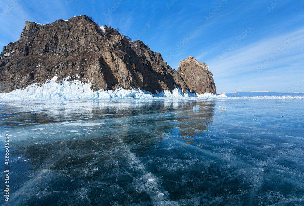 Φωτογραφία Winter landscape of frozen Baikal Lake with beautiful rocks of northern tip of Olkhon Island and famous Deva Rock of Cape Khoboy on sunny day