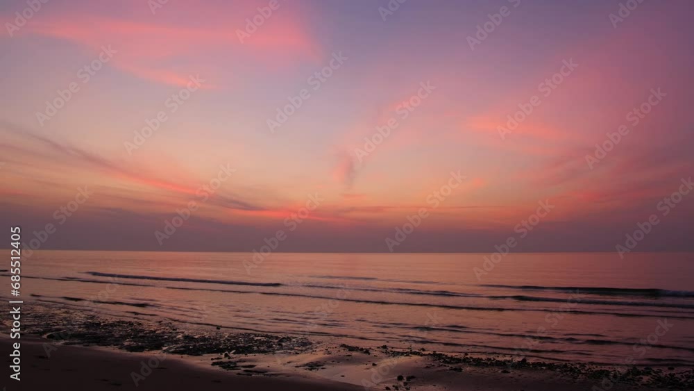 Twilight and dawn sky with cumulus cloud time lapse in a morning at a tropical beach 4k footage. Twilight and dawn sky with cumulus cloud time lapse in a morning at a tropical beach 4k footage.
