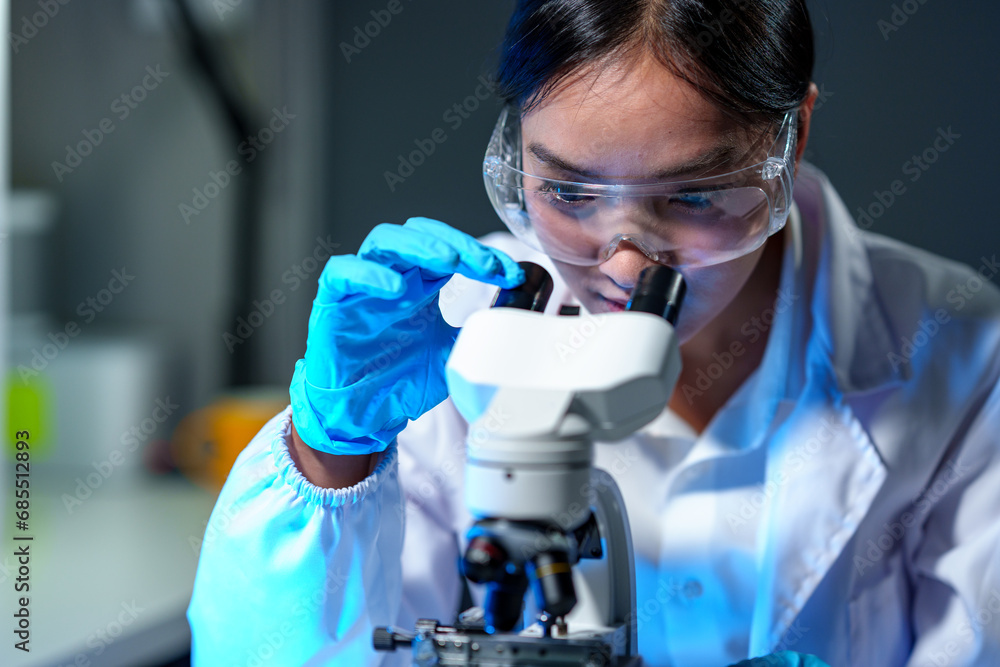 Biochemical research scientists are conducting research in a medical laboratory working with microscopes for vaccine development. pharmaceutical research label Focus on selection. Biochemical research scientists are conducting research in a medical laboratory working with microscopes for vaccine development. pharmaceutical research label Focus on selection.