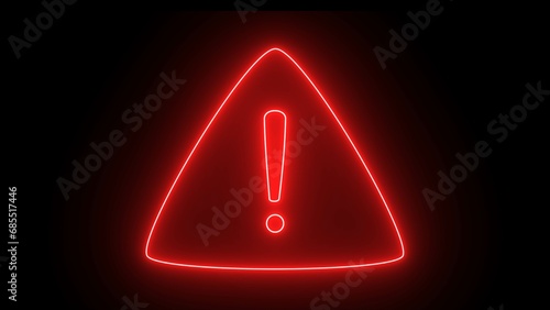 Red color neon warning sign on the black background. Neon light exclamation text icon. warning icon. neon sign , red color text. photo