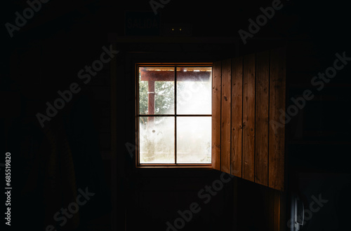 Window of a wooden cabin in nature