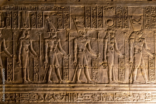 Fényképezés Ancient egyptian hieroglyphs carved on golden wall of Edfu Temple